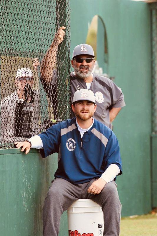Coach Niko at the fence during a game